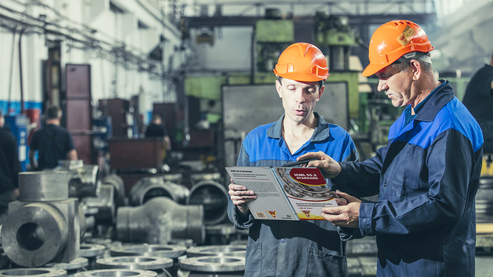 Technicians consulting the ICML 55.2 Standard