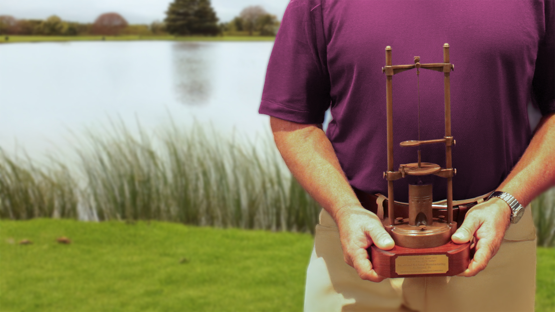 An ICML award recipient holding the Gill Award trophy