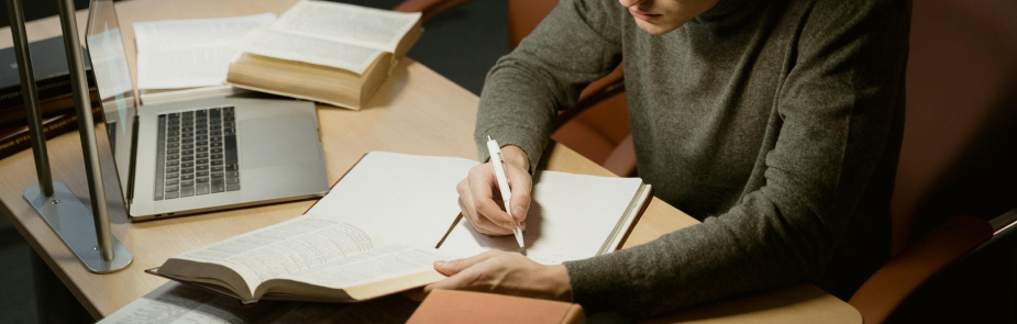 Procedures image, man writing on a book