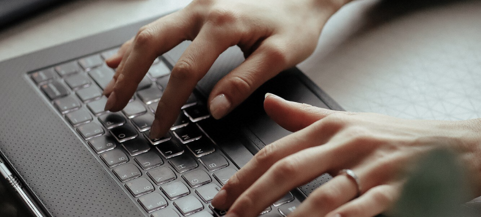 Hands typing on a keyboard while learning about the ICML 55 Standard